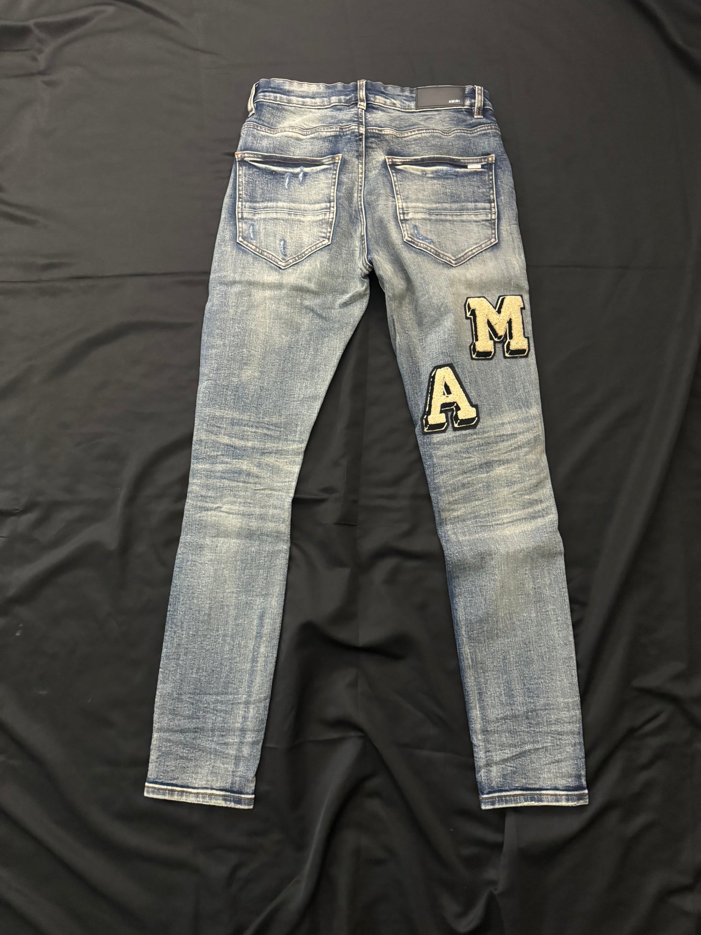 AMIRI BLUE VARSITY JEANS