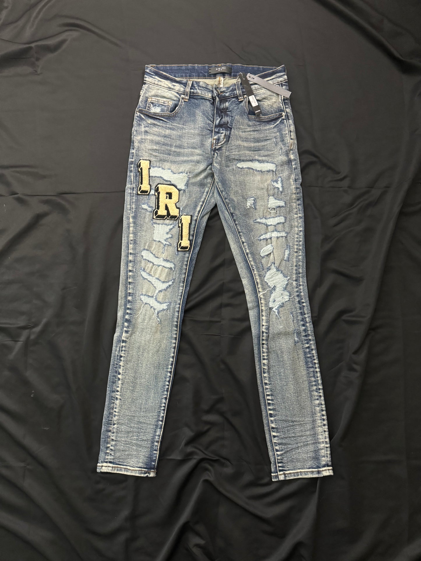 AMIRI BLUE VARSITY JEANS