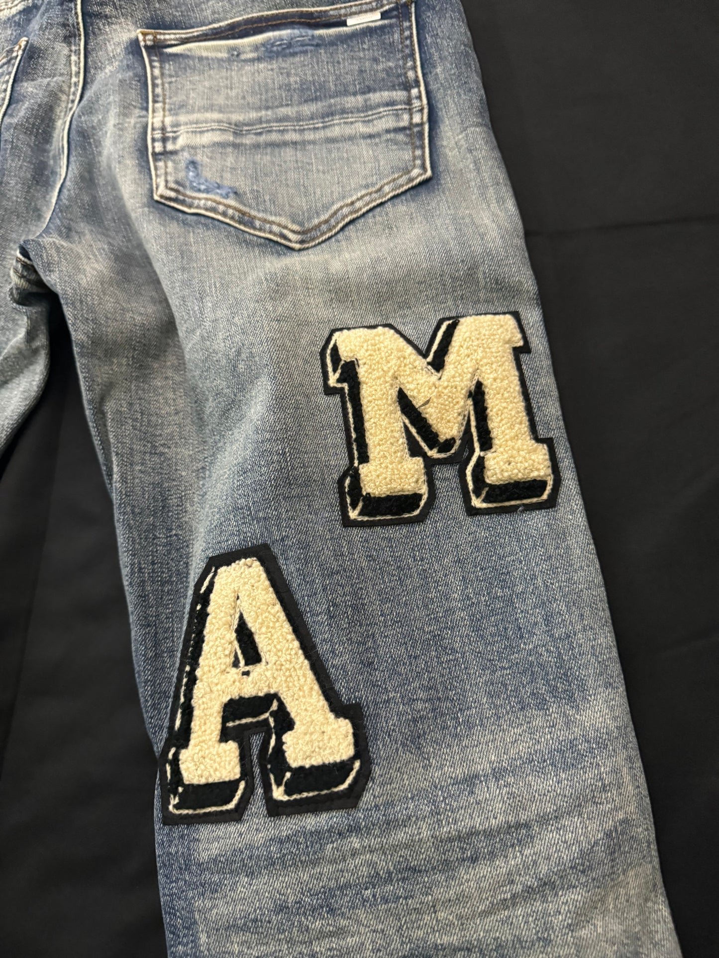 AMIRI BLUE VARSITY JEANS